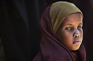 A Somali refugee girl waits to be registered by the United Nations High Commission of Refugees at Dagahaley camp in Dadaab in Kenya's northeastern province