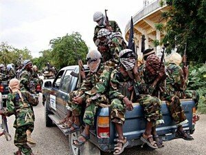 Radical Islamist Shebab members ride in the back of a pick up truck in Mogadishu, in September